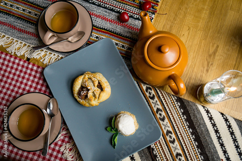 Traditional Georgian sweets and desserts with hazelnuts, walnuts, grape juice, honey, chocolate. Baklava, nakhini, churchkhela. Fresh fruits and candied fruits. Traditional Turkish coffee. photo