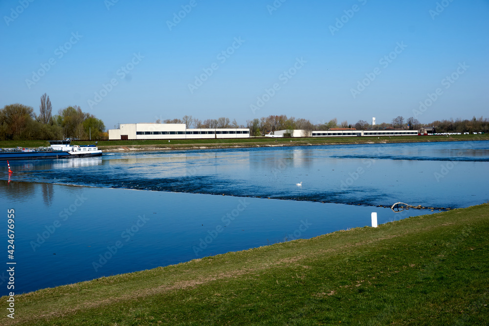 beautiful rhine river with blue water in sunshine in the middle of green landscape beautiful rhine river with blue water in sunshine in the middle of green landscape