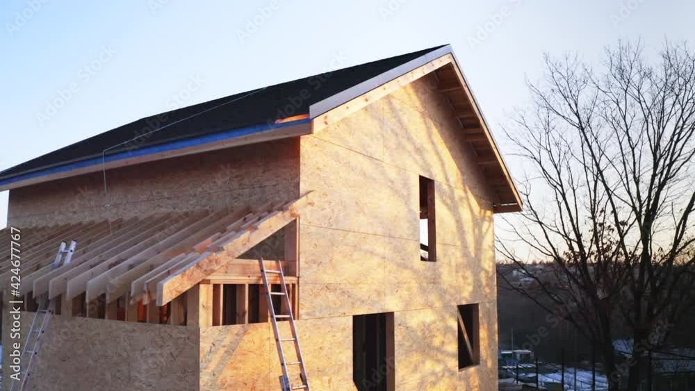 Aerial panoramic view of unfinished wooden frame house in the evening Aerial panoramic view of unfinished wooden frame house in the evening
