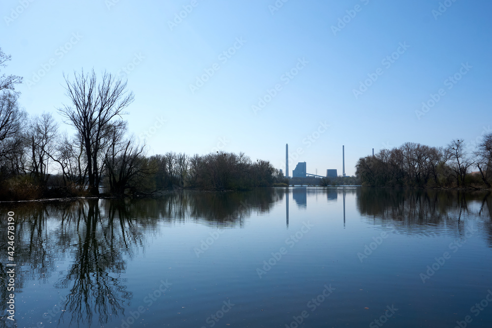 beautiful blue lake with chimneys in the background beautiful blue lake with chimneys in the background