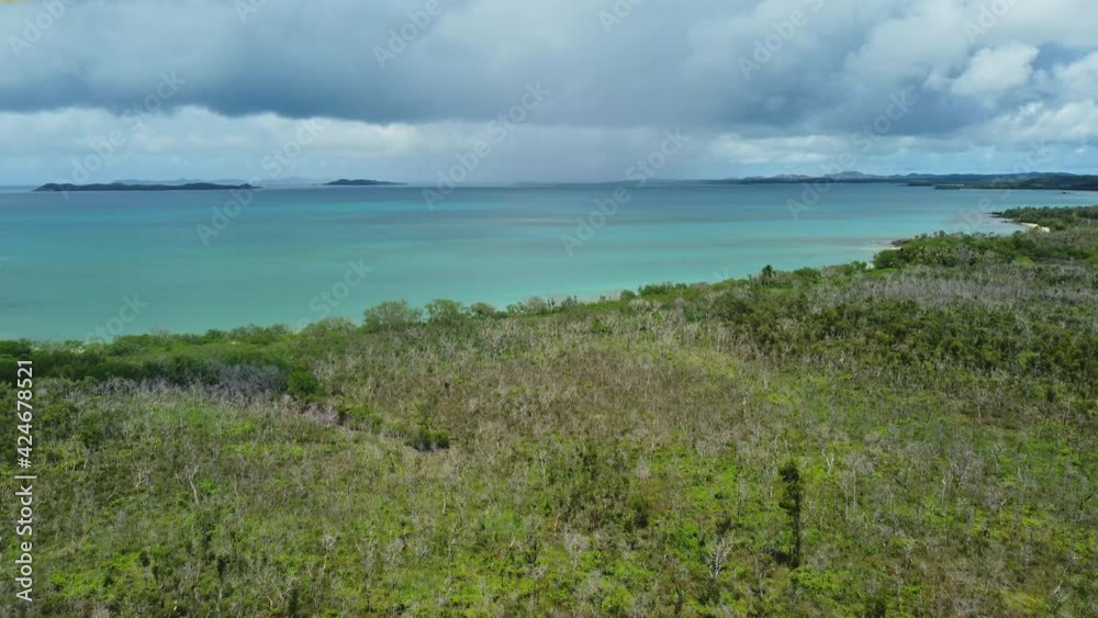 Flyover above forested beach near Poingam and Boat Pass, New Caledonia. Flyover above forested beach near Poingam and Boat Pass, New Caledonia.