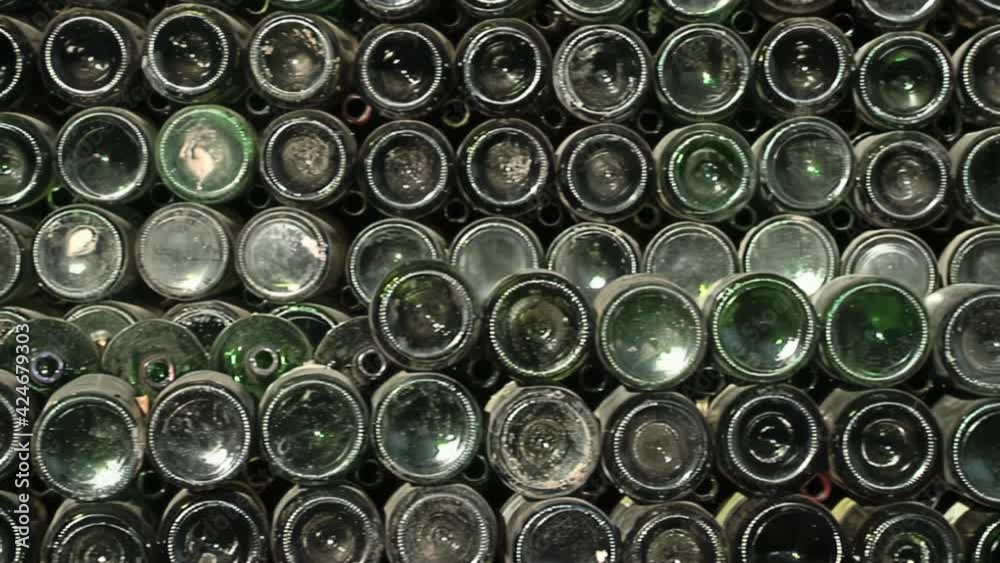 Empty Wine Bottles Stacked for Recycle in a Glass Marble Factory.  