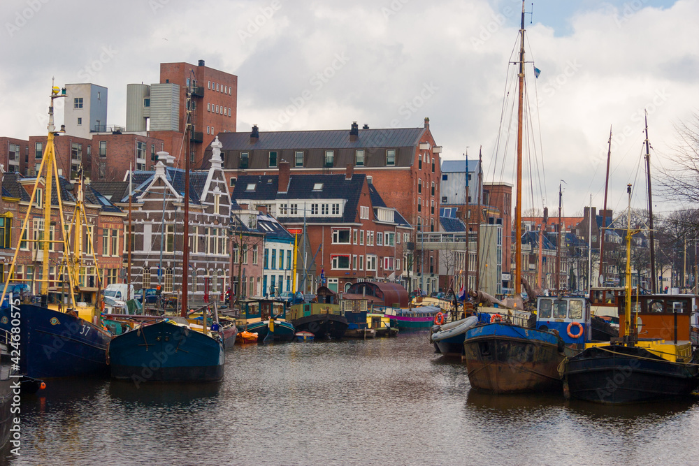Noorderhaven (northern Harbour) in Groningen with old warehouses converted to houses along the water.
