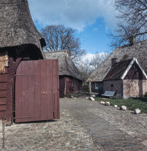 Traditional historic farms in winter at Open air museum Orvelte Westerbork Drenthe Netherlands. Village. Countryside. Reed roofs. Barn. Saxion village. photo