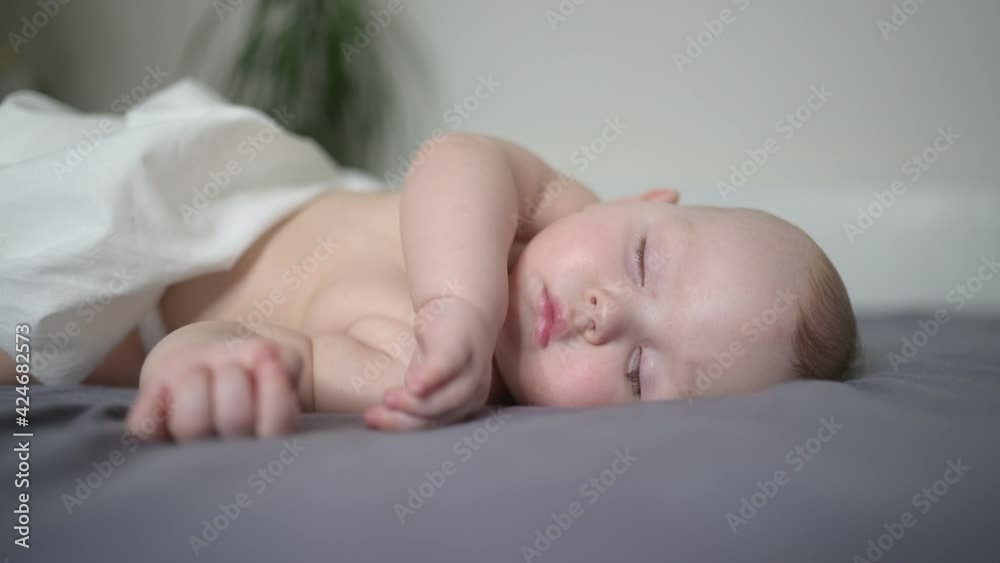 Cute emotional funny yawning newborn little baby boy sleeping in crib. Baby goods packaging template. Healthy child, concept of hospital and happy motherhood. Infant baby. Nursery. Cute emotional funny yawning newborn little baby boy sleeping in crib. Baby goods packaging template. Healthy child, concept of hospital and happy motherhood. Infant baby. Nursery.