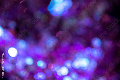 Blue, purple and turquoise bokeh lights. Magic festival color lights. Background or backlight
