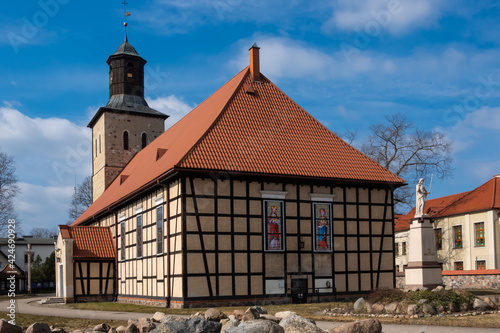 An example of a half-timbered wall (Prussian Wall)  used in religious architecture. Made on a sunny day. object against the blue sky. City of Pisz, Poland photo