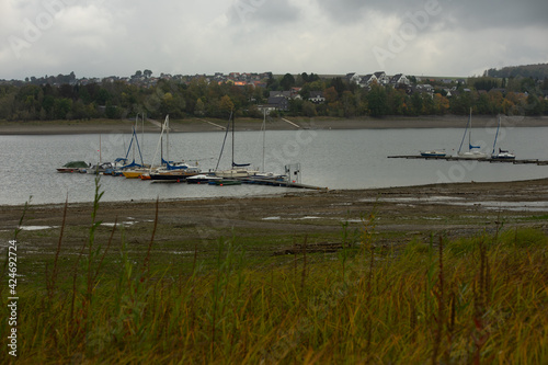 View from the german lake called Moehnesee with tiny boats photo