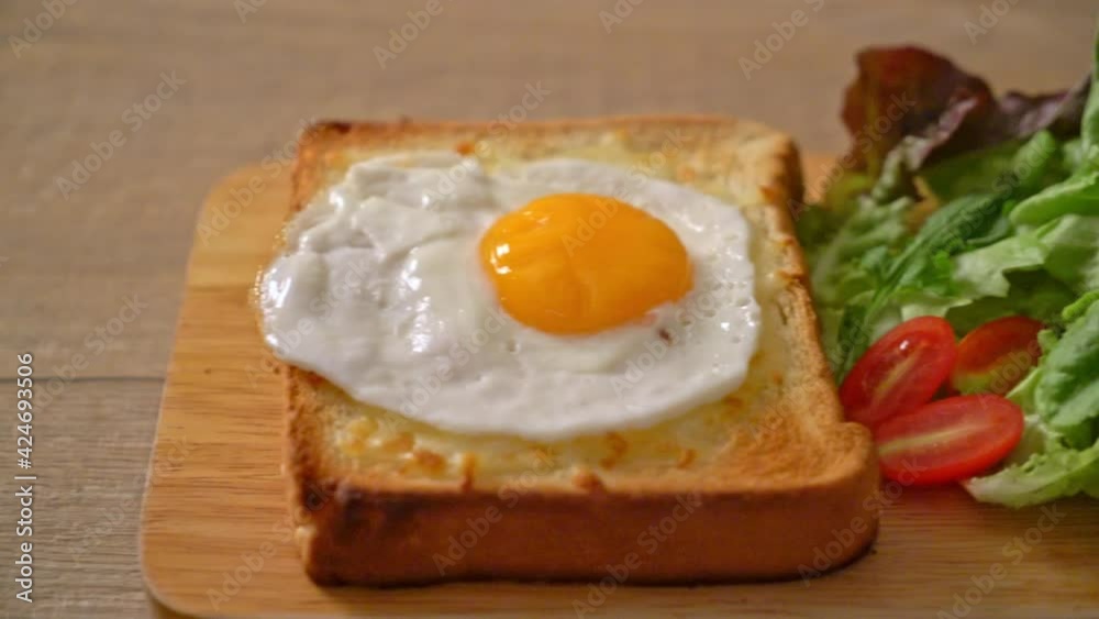 homemade bread toasted with cheese and fried egg on top with vegetable salad for breakfast homemade bread toasted with cheese and fried egg on top with vegetable salad for breakfast
