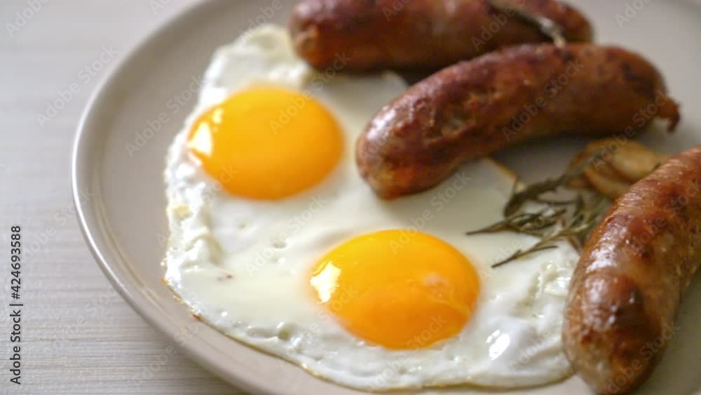 homemade double fried egg with fried pork sausage - for breakfast homemade double fried egg with fried pork sausage - for breakfast