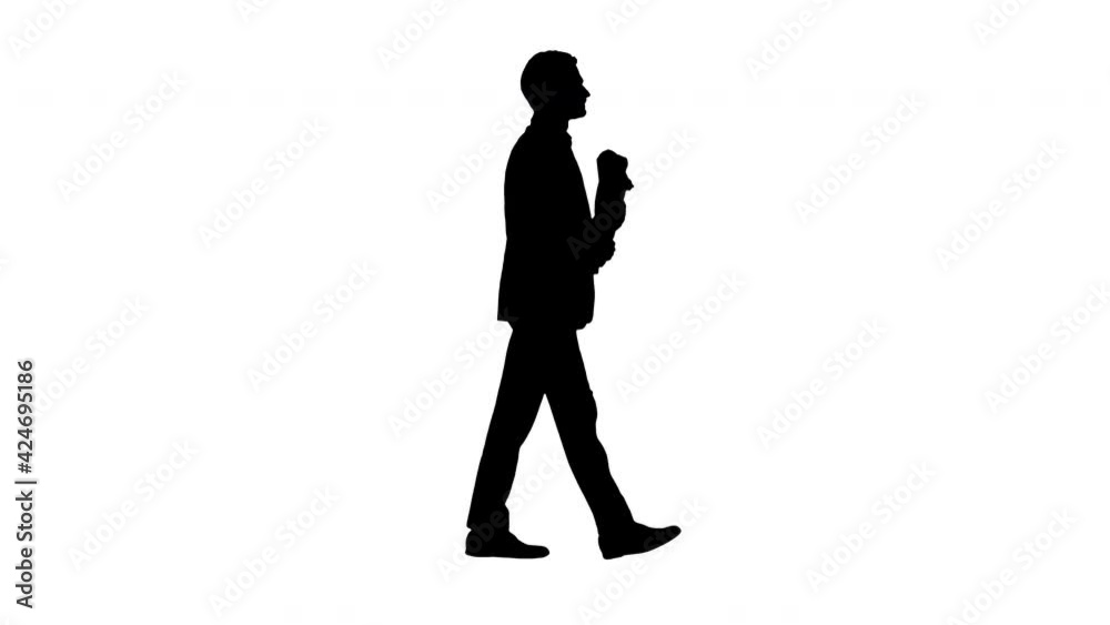 Silhouette Handsome man walking to the date with bouquet of roses. Silhouette Handsome man walking to the date with bouquet of roses.
