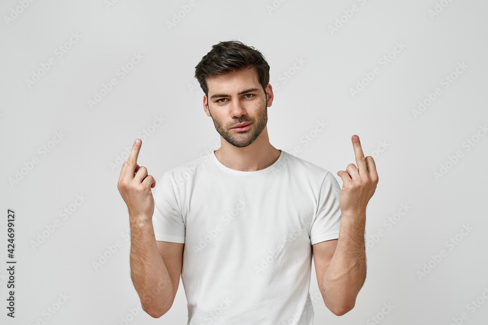 Man in t-shirt showing middle finger doing fuck Man in t-shirt showing middle finger doing fuck