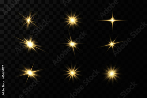 Shining golden stars isolated on black background. Effects, glare, lines, glitter, explosion, golden light. Vector illustration.Set. 