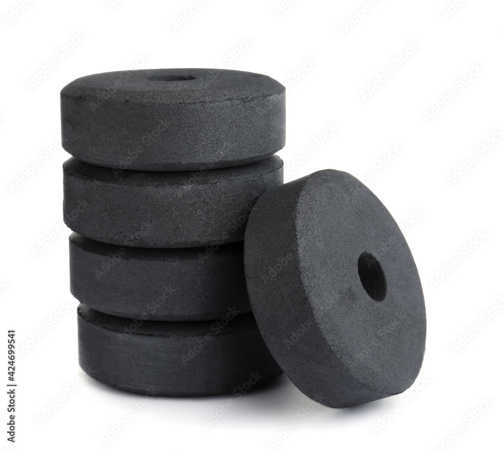 Stack of charcoal rings for hookah on white background Stack of charcoal rings for hookah on white background