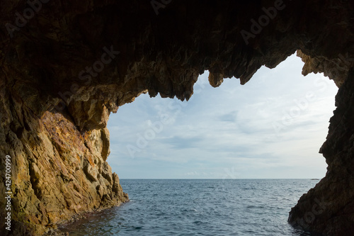 Picturesque waterfront caves at Mediterranean coast in summer