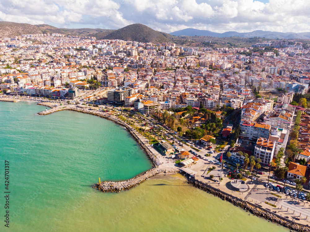 Picturesque panorama of Turkish coastal city of Kusadasi on bank of Aegean Sea on sunny day