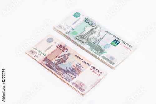 Several bills of one thousand and five hundred rubles of the Russian Federation isolated on white background