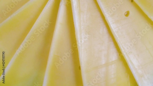  Cheese cut slices background. natural dairy product