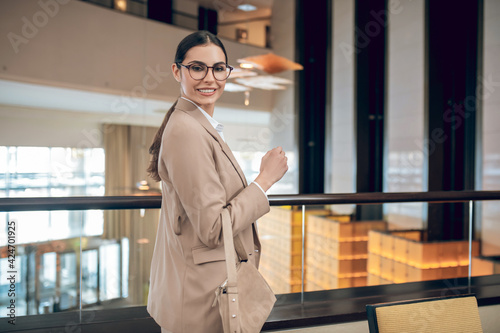 Stylish businesswoman in beige jacket sworking in the office © zinkevych