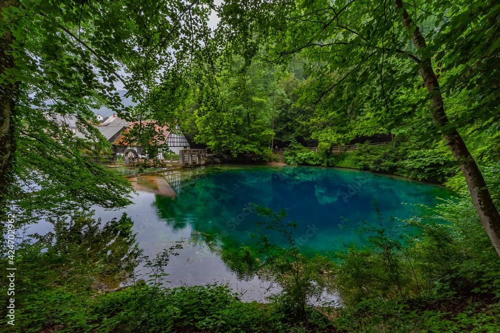 Touristic highlight Blautopf in the old town of Blaubeuren in german region swabian alb Touristic highlight Blautopf in the old town of Blaubeuren in german region swabian alb