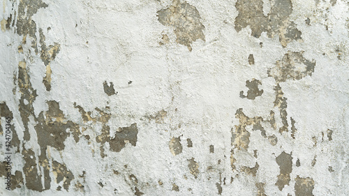 Background of old vintage dirty brick wall with peeling plaster, texture