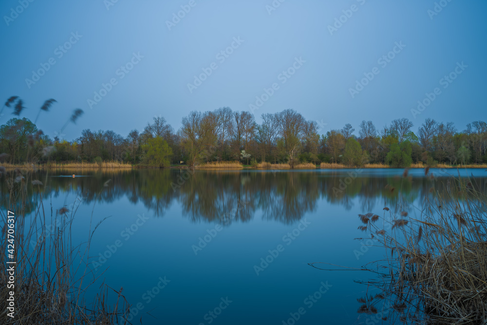 Panoramic landscape with the fishing lake near Ketsch in Germany.