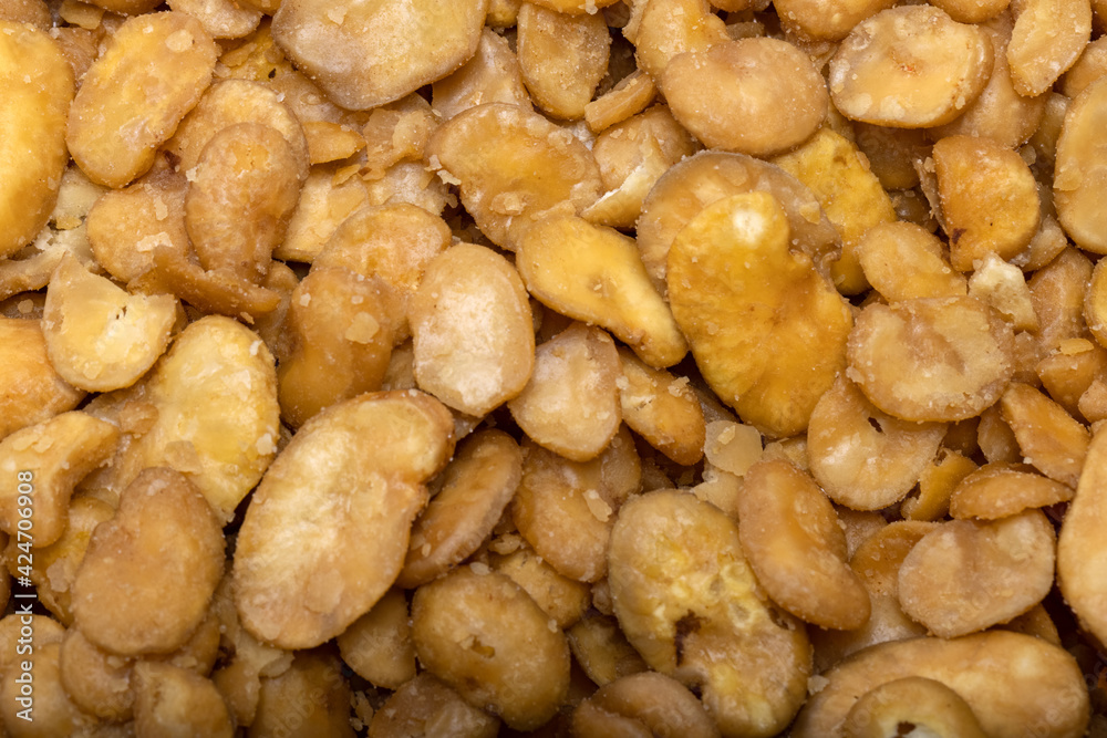 Roasted and salted fava beans for a healthy vegan and vegetarian diet snack. High in protein, vitamins, dietary fibre and nutrients Roasted and salted fava beans for a healthy vegan and vegetarian diet snack. High in protein, vitamins, dietary fibre and nutrients