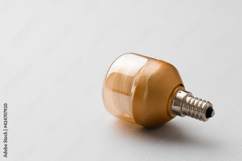 Light bulb on light grey paper background Light bulb on light grey paper background