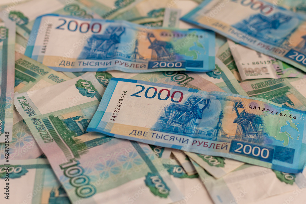 Money Russian banknotes in denominations of two thousand and one thousand rubles.Money background. Money Russian banknotes in denominations of two thousand and one thousand rubles.Money background.