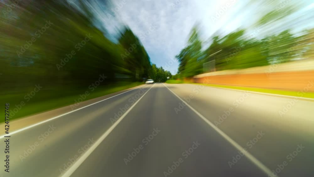 4K Point of View Hyperlapse Time-lapse of Car Driving Through Small Suburbia Trees Stretch on Both Sides High Speed On The Open Road Fast Car Hyperlapse Road Trip Travel Concept Sort of Dashcam POV 4K Point of View Hyperlapse Time-lapse of Car Driving Through Small Suburbia Trees Stretch on Both Sides High Speed On The Open Road Fast Car Hyperlapse Road Trip Travel Concept Sort of Dashcam POV