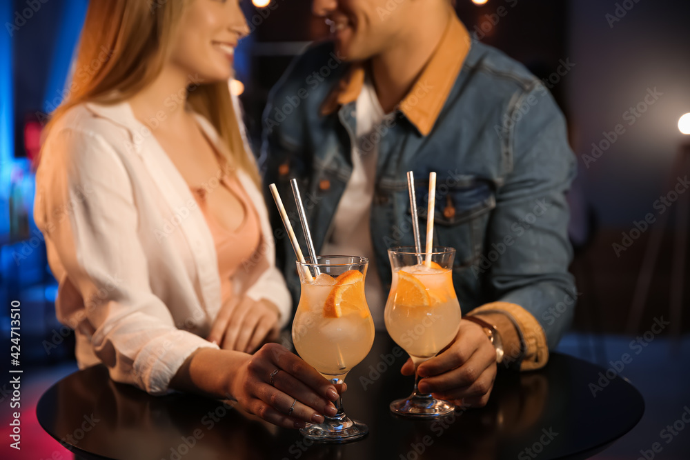 Man and woman flirting with each other in bar, closeup Man and woman flirting with each other in bar, closeup