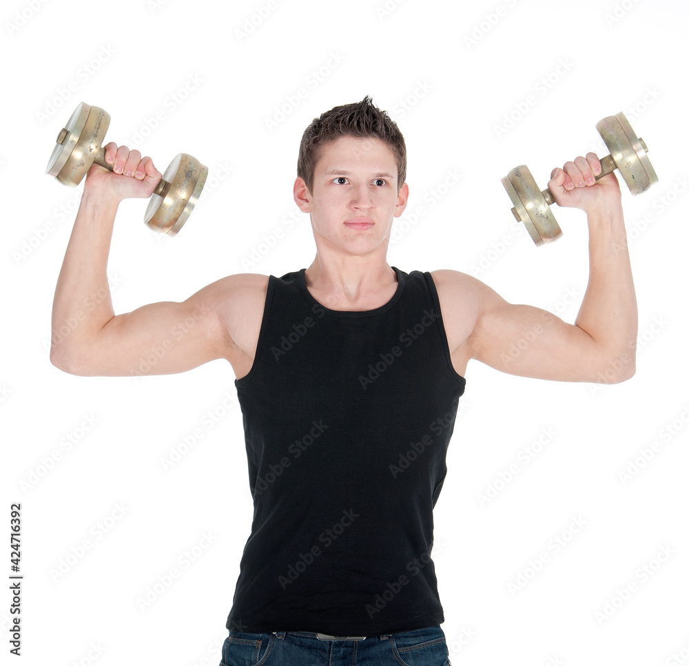 Portrait of a healthy young man doing exercise with dumbbell against white background Portrait of a healthy young man doing exercise with dumbbell against white background