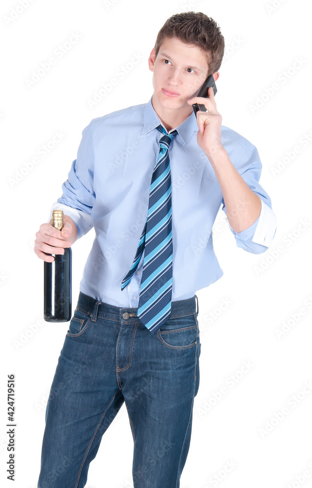 Young business man wearing blue shirt and tie with bottle of wine speaking on a phone Young business man wearing blue shirt and tie with bottle of wine speaking on a phone