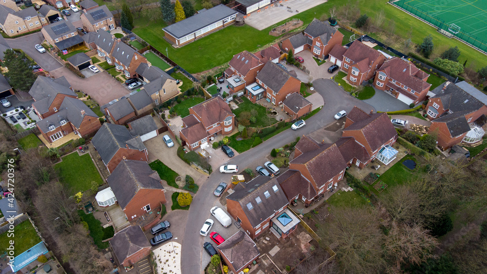 Aerial photo of a typical residential housing estate in the UK, taken in the village of Alverthorpe in Wakefield West Yorkshire showing a modern cul-de-sac residential housing estate in the spring