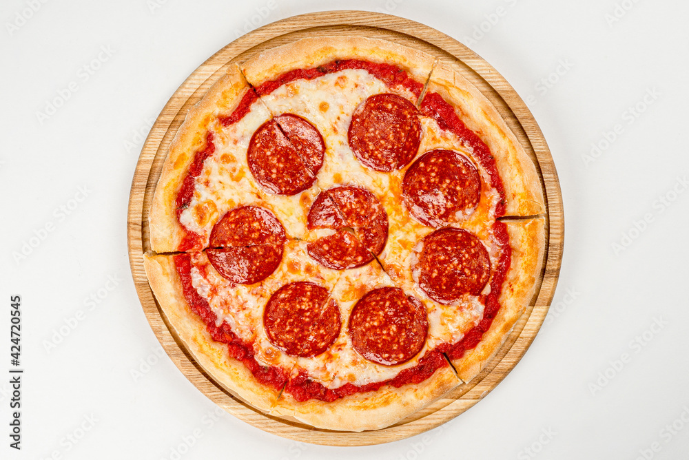 Cooked pepperoni pizza with sausage on white plate Cooked pepperoni pizza with sausage on white plate