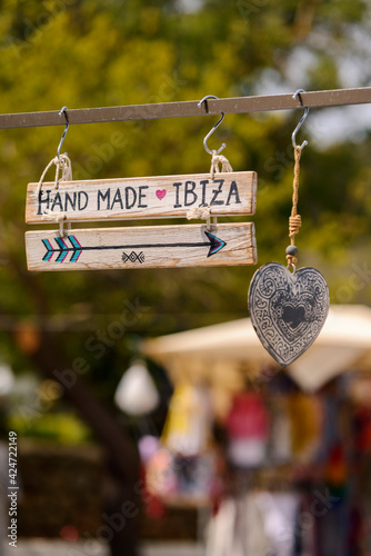 Wooden plaque with the inscription Hand Made Ibiza..Hippie market.