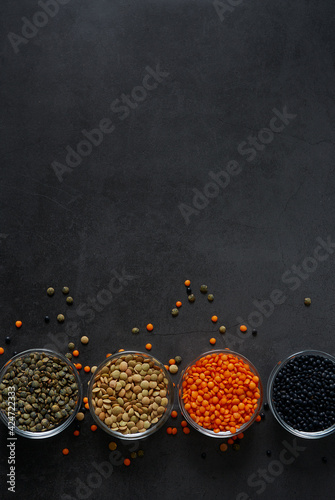 lentil assortment on black stone surface © Diana Taliun