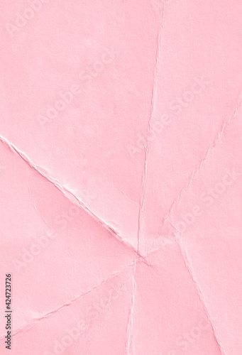 Wrinkled pink paper texture background.