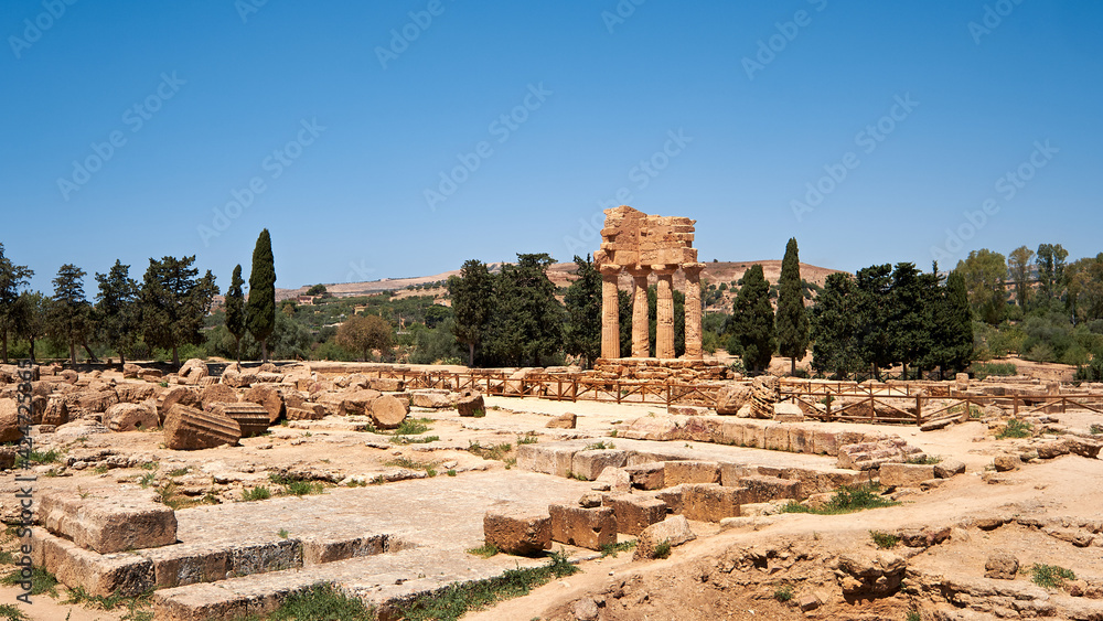 The temple of Castor and Pollux, Dioscuri brothers. It has only four columns left and has become the symbol of Agrigento. Valley of the Temples in Agrigento, Sicily, Italy.