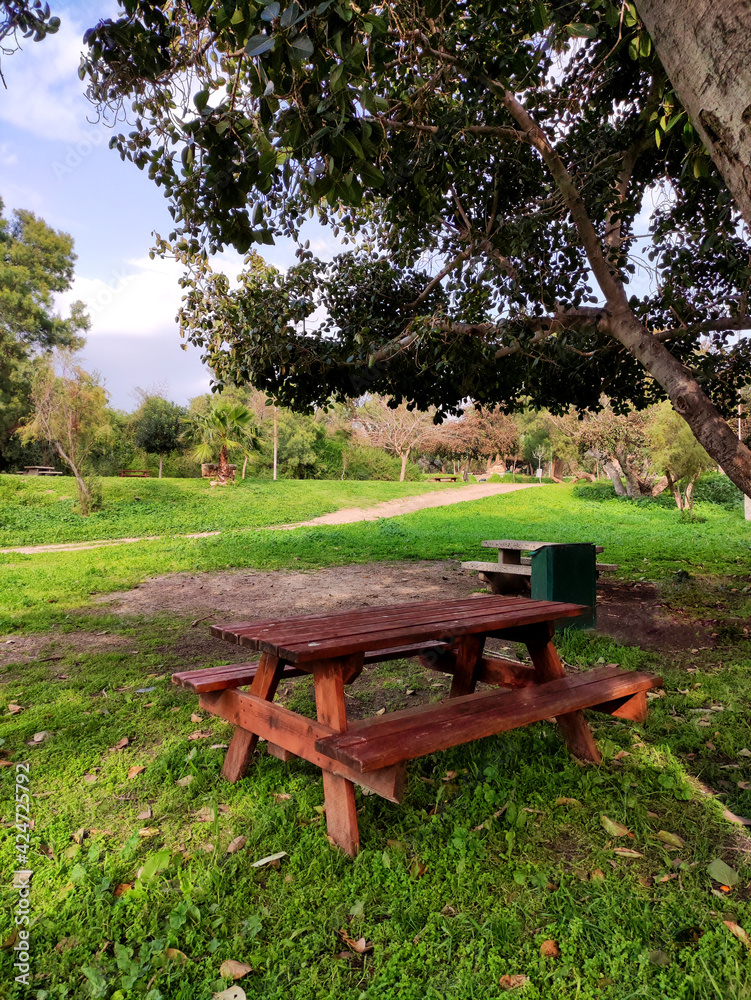 View of campsite with a picnic table in a nature reserve.