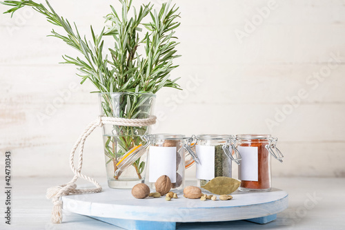 Fototapeta Naklejka Na Ścianę i Meble -  Composition with different spices on light wooden background