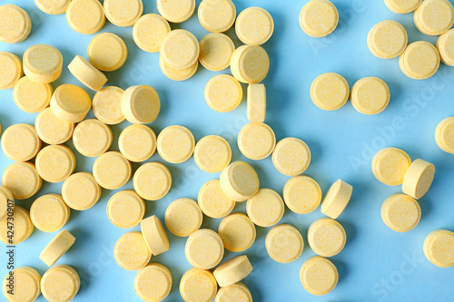 Folic acid pills on color background