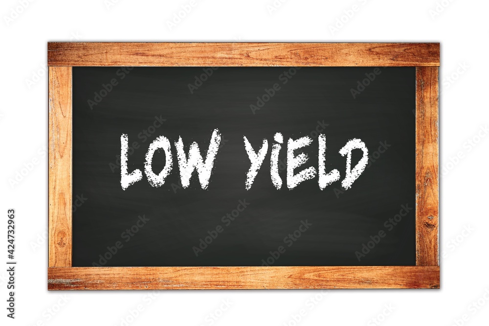 LOW YIELD text written on wooden frame school blackboard. LOW YIELD text written on wooden frame school blackboard.