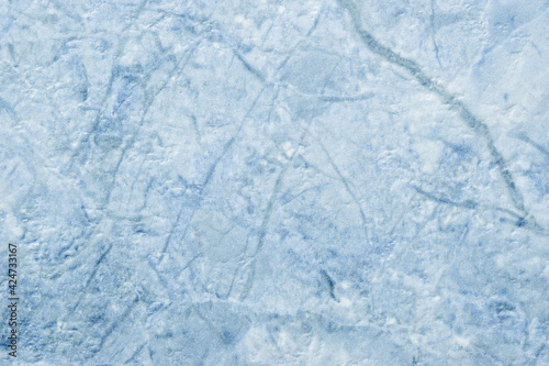 Texture of decorative light blue plaster imitating the old peeling stone wall.
