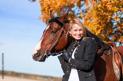 beautiful woman walking with horse