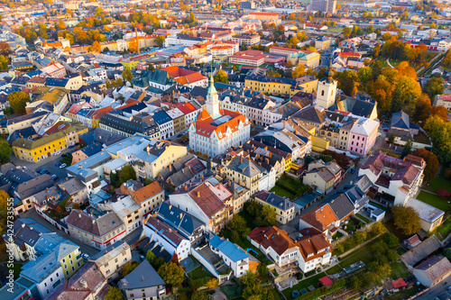 Panoramic aerial view of autumn landscape of Czech town of Sumperk with Church of Saint John Baptist and Town hall at sunrise  Olomouc Region