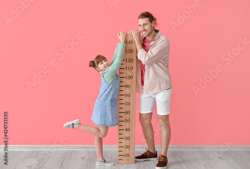 Cute little girl and her fa...