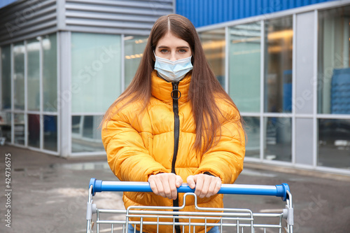 Young woman in medical mask...