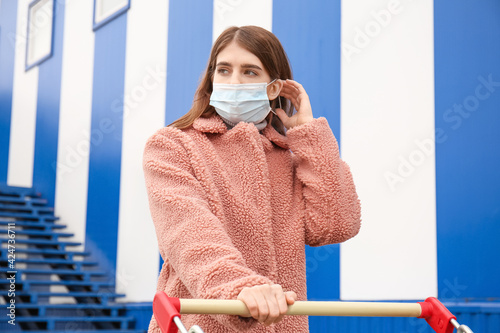 Young woman in medical mask...