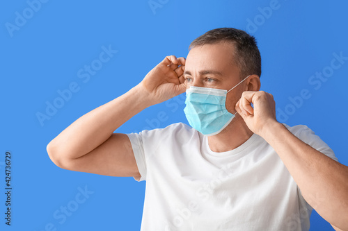 Mature man in medical mask ...